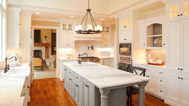 Small kitchen with a centerpiece chandelier light in the middle