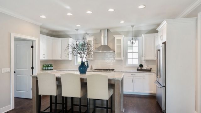 A small kitchen with recessed lighting